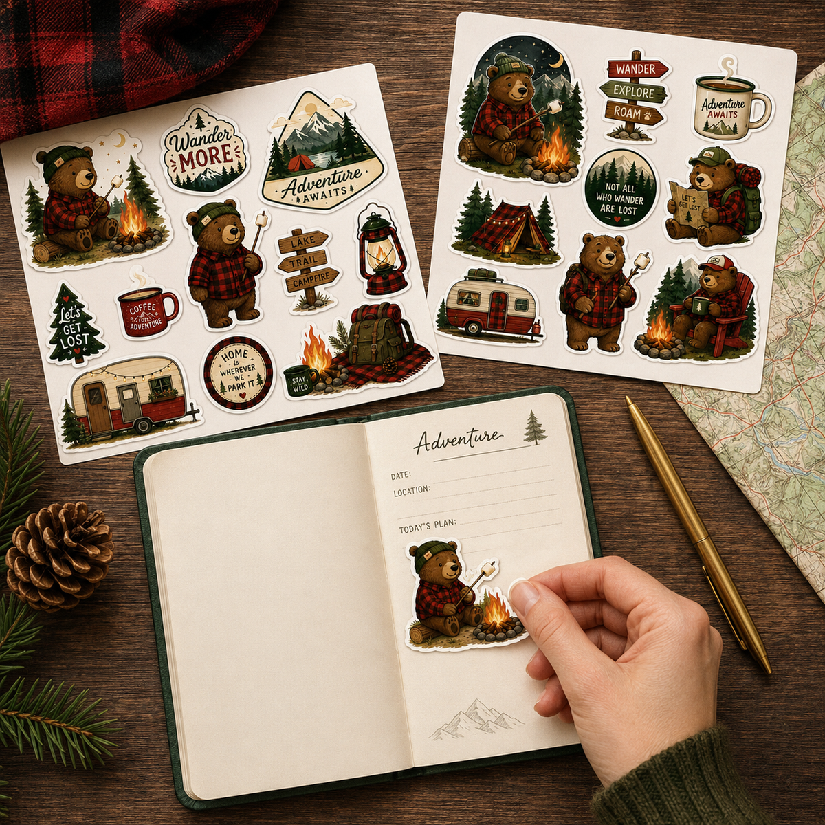 Camping Bear Adventure sticker sheets beside an open travel journal with a hand applying a bear sticker.