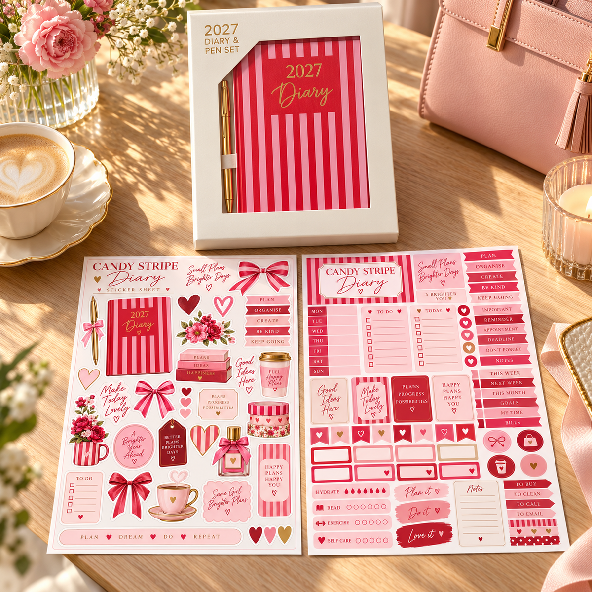 Boxed red and pink striped 2027 diary and gold pen beside a blush handbag with two sticker sheets