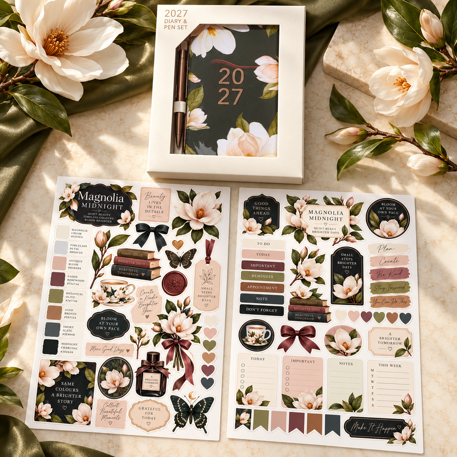 Magnolia Midnight 2027 mini diary and pen with two floral sticker sheets on an ivory desk