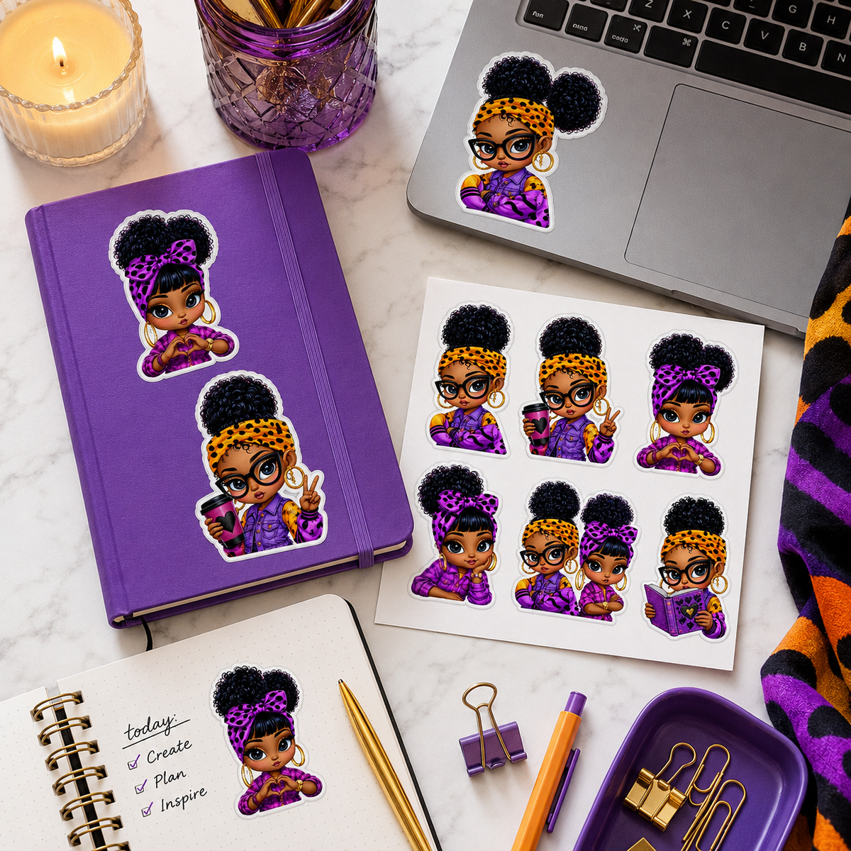 Purple and orange Black girl stickers decorating a journal, planner and laptop.